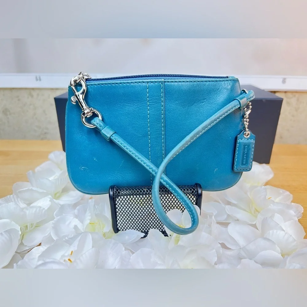 Coach Legacy Leather Small Wristlet. design is  featured during Coach’s 65th